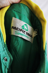 Women's or men's vintage 1980's Pacific Trail Sportswear label long sleeve green zip up nylon puffer jacket with yellow and rainbow colored trim.