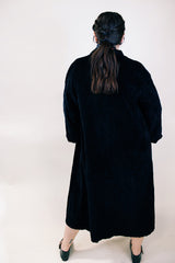 Women's vintage 1960's ankle length long sleeve black velvet duster jacket. Fully lined and has two side pockets.