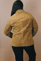 Men's or women's vintage 1970's Genuine Leather label size medium long sleeve light tan brown suede western style jacket with popper buttons.