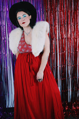 Women's vintage 1980's maxi length sleeveless red polyester halter wrap dress. Has silver sequins and beads on front chest.