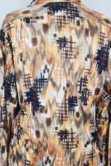 Men's vintage 1970's D'Avila label long sleeve button up shirt in all over abstract orange and green abstract print in slinky polyester material.
