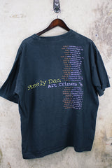 Women's or men's vintage 1996 Made in El Salvador label short sleeve black Steely Dan tour tee with multicolored graphic on front and back.