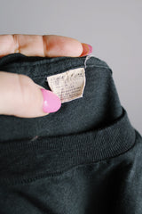 Women's or men's vintage 1970's Made in USA label short sleeve black colored Jethro Tull tour tee with graphic on front and back in white in cotton material.