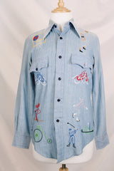 Men's or women's vintage 1970's BJ-R, Long Tail - Form Fit, Made in Hong Kong label long sleeve light blue denim chambray button up shirt with colored embroidery all over.