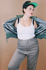 Men's vintage 1980's Flyer's CWU Military Flyer's Jacket, Made in USA label size medium long sleeve cropped length army green zip up bomber jacket with orange liner.