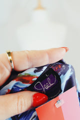 Men's vintage 1970's Joel label long sleeve button up shirt with all over red, blue, and navy abstract print in slinky polyester material.