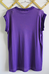 Women's vintage 1990's Doherty & Dunne Sporting Goods label sleeveless mesh nylon material sports jersey tee with ribbed knit trim. Purple with yellow letters that say lady pirates.