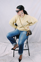 Men's or women's vintage 1960's Pringle label long sleeve pullover sweater in lambswool material. Butter yellow color and all over cable knit texture.