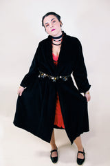 Women's vintage 1960's ankle length long sleeve black velvet duster jacket. Fully lined and has two side pockets.