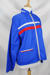 Women's or men's vintage 1970's Zody's Quality Plus, Made in Japan label long sleeve bright blue nylon zip up windbreaker with white and red trim.