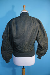 Women's or men's vintage army bomber jacket. Cropped and reversible in a Nylon material. One side is army green and one side in orange.