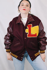 Men's or women's vintage 1980's Settlemien's label long sleeve maroon varsity letterman jacket with a yellow patch and trim.