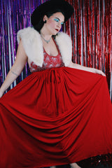 Women's vintage 1980's maxi length sleeveless red polyester halter wrap dress. Has silver sequins and beads on front chest.