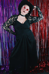 Women's vintage 1980's Made in USA label long sleeve ankle length black dress made with Polyester material.