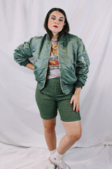 Men's or women's army zip up bomber jacket with long sleeves. Army green color with orange satin liner. Reversible.