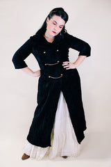 Women's vintage 1960's Raymodes, NY label long length long sleeve black velvet duster coat. Bronze buttons with bronze chains.