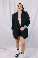 Men's or women's vintage 1970's University Seal Authentic Fashion label long sleeve navy blue wool blazer with all over pin stripes. Has pockets, textured buttons, and a back slit.