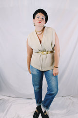 Men's or women's vintage 1970's Norsewear, Made in New Zealand label sleeveless zip up wool material vest in an oatmeal cream color. Ribbed texture all over.