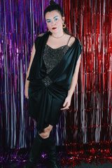 Women's vintage 1980's Stash label sleeveless mini length black dress with bronze metallic details.