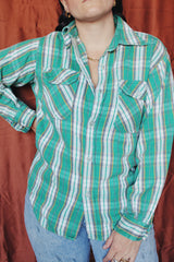 Women's or men's vintage 1970's Montgomery Ward label long sleeve button up flannel shirt in green and white plaid print.