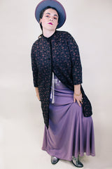 Women's vintage 1960's Helen's Fashion Shoppe, McMinnville, Oregon label long sleeve long length jacket in a black and purple tapestry print.
