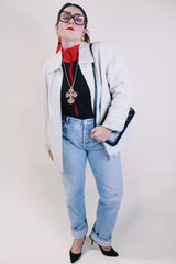 Women's vintage 1990's Worthington label long sleeve bone white leather jacket with a collar, a zipper up the front, and two side pockets.