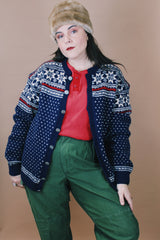 Women's or men's vintage 1970's Norway Handknitted label size large navy blue Norwegian style button up wool cardigan with all over white and red print