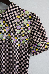 Women's vintage 1970's short sleeve puff sleeve bodysuit with collar in a black and purple checkered print and florals.