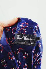 Men's or women's vintage 1970's Bud Berma label long sleeve nylon material navy blue button up shirt will all over red print.
