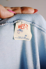 Men's or women's vintage 1970's Hef-T, Tee Jays, Made in USA label baby blue tee with Jim Conway show bright blue graphic on the front in cotton and polyester material.