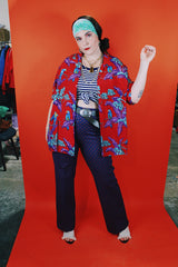 Men's vintage 1970's Michael Gerald Ltd., Hand Screened short sleeve button up shirt in an all over Hawaiian print with parrots.