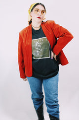 Women's vintage 1970's Deerskin Quality Leathers long sleeve open front lightweight suede leather jacket in a vibrant burnt orange color.