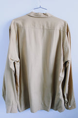 Men's vintage 1950's Viyella, Manhattan label long sleeve button up shirt with collar and two chest pockets in a tan mustard yellow color.