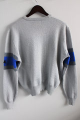 Men's or women's vintage 1980's Demetre, Made in USA label long sleeve pullover crew neck sweater in light grey with colored pattern across chest in wool material.