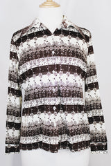 Women's vintage 1970's long sleeve button up blouse with dagger collar in white and chocolate brown colors with all over ditsy floral print.