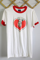 Women's or men's vintage 1970's Sneakers, Made in USA label short sleeve white t-shirt with red trim on neckline and cuffs with graphic on the front.