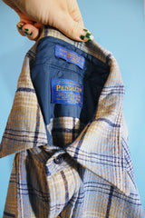 Men's vintage 1970's Pendleton label long sleeve button up western style shirt in a wool material and blue colors. Pearl silver snapper buttons.