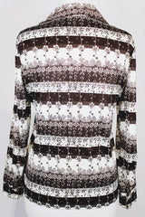 Women's vintage 1970's long sleeve button up blouse with dagger collar in white and chocolate brown colors with all over ditsy floral print.