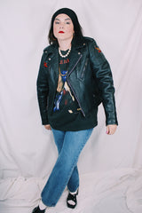 Men's or women's vintage 1970's Harley-Davidson label long sleeve black leather motorcycle jacket with silver hardware and patches.