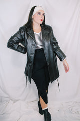 Women's vintage 1980's Leather King label long sleeve dark chocolate brown long length leather coat with button front closure and matching tie belt.