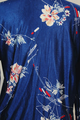 Men's or women's vintage 1970's Montgomery Ward label shiny vibrant navy blue button up shirt with dagger collar and all over floral print.