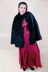 Women's vintage possibly 1940's black colored pony fur large cape poncho with fur trim around the edges. Has a closure at the neck and the peter pan collar and fully lined.