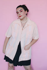 Men's vintage 1970's Mexacali label short sleeve peach orange colored button up cabana shirt with white embroidery and pleats on the front.