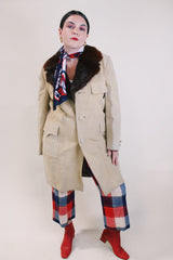 Men's or women's vintage 1970's tan suede long length long arm jacket with brown fur trim around collar. Matching suede belt.