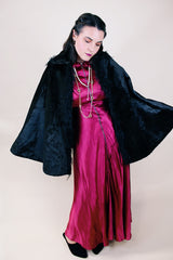 Women's vintage possibly 1940's black colored pony fur large cape poncho with fur trim around the edges. Has a closure at the neck and the peter pan collar and fully lined.