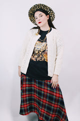 Women's vintage 1970's long sleeve cream colored button up acrylic sweater with scalloped edges on hem and cuffs.