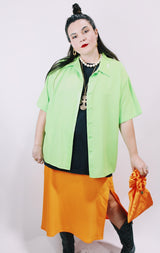 Women's vintage 1980's Collection by Shirq, New York, Made in USA label short sleeve bright lime green button up blouse with collar and shiny trim in a lightweight poly material.