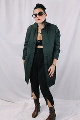 Men's or women's vintage 1960's Brent Prep Sold Exclusively by Montgomery Ward long sleeve long length cotton material lightweight trench coat in a dark green and all over subtle plaid print.