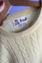 Men's or women's vintage 1960's Pringle label long sleeve pullover sweater in lambswool material. Butter yellow color and all over cable knit texture.