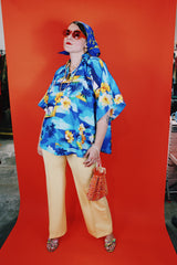 Women's vintage 1980's Made in Hawaii short sleeve wide cape blouse in all over blue Hawaiian print.